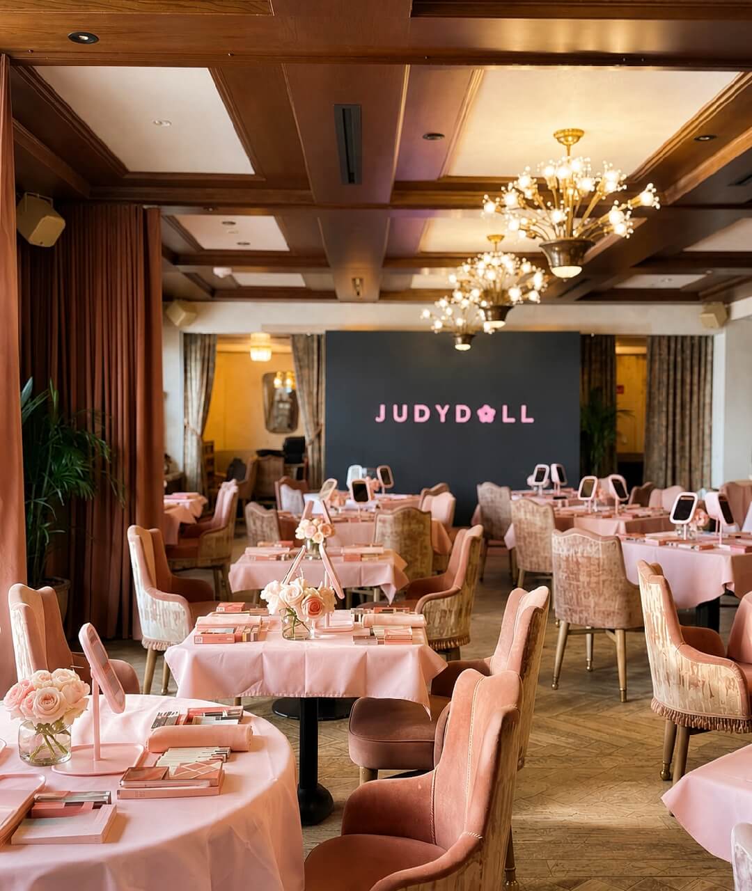 Corporate Event Venue Custom Stage Backdrop Design Elegant corporate brand event setup featuring customized table settings, premium ambient venue lighting, and a professional custom backdrop stage wall built for high-end product launch event production rentals.